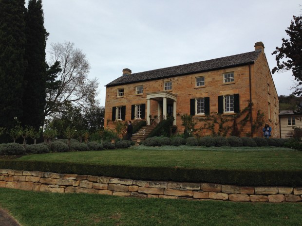 Topiary and immaculate lawns at the front of the house