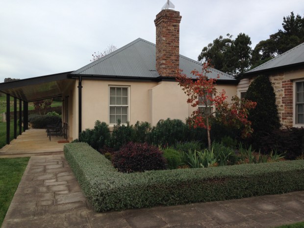 Interesting mixed garden filling the corner of the L-shape cottage, simply and neatly
