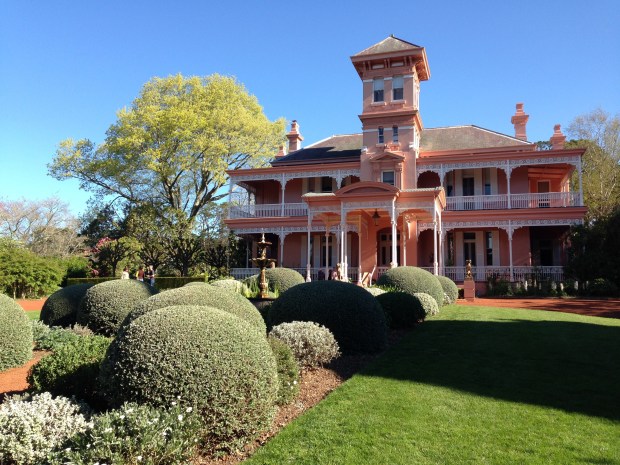 Fountain and topiary balls in front of the house at Retford Park
