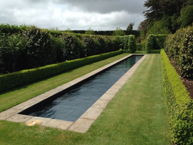 Dark reflection pool at Gravetye Garden