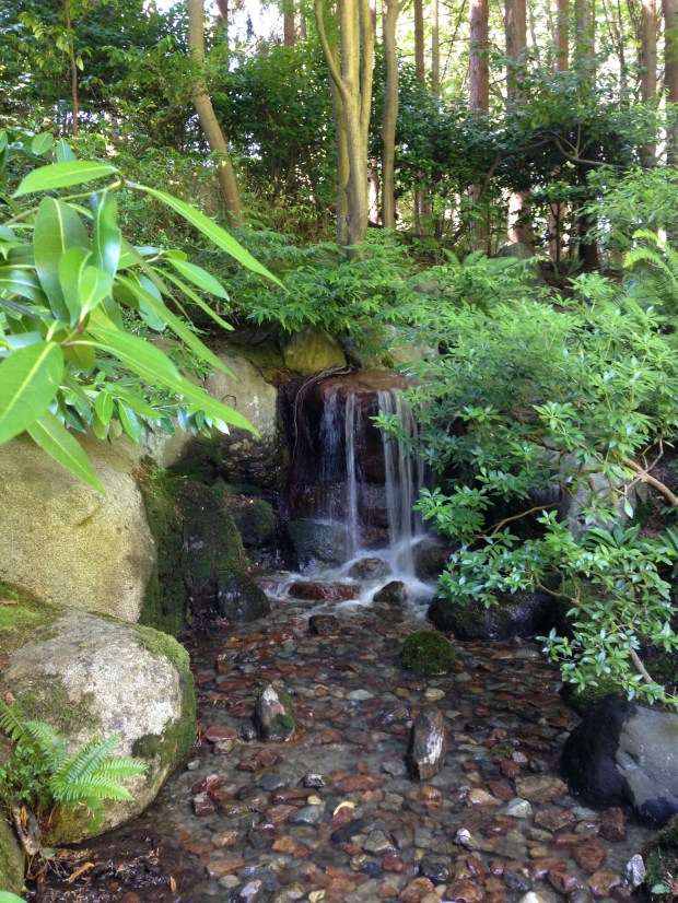 Carefully placed rocks create a beautiful waterfall at Nitobe Japanese Garden