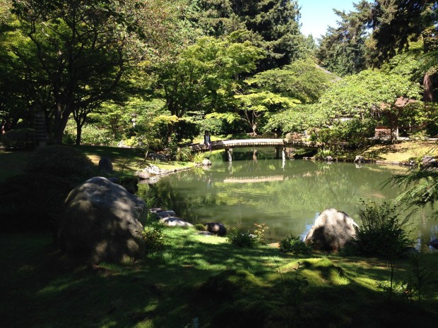 Girl in contemplation on the bridge at Nitobe Japanese Garden