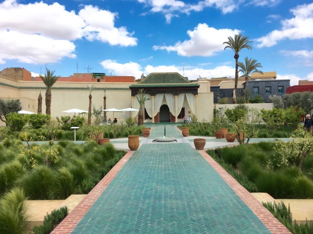 Traditional Islamic green tiles lead to a central water feature at Le Jardin Secret