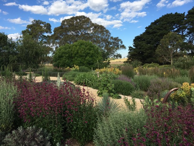 Informal gravel paths are the perfect foil for loose perennials in this rural location